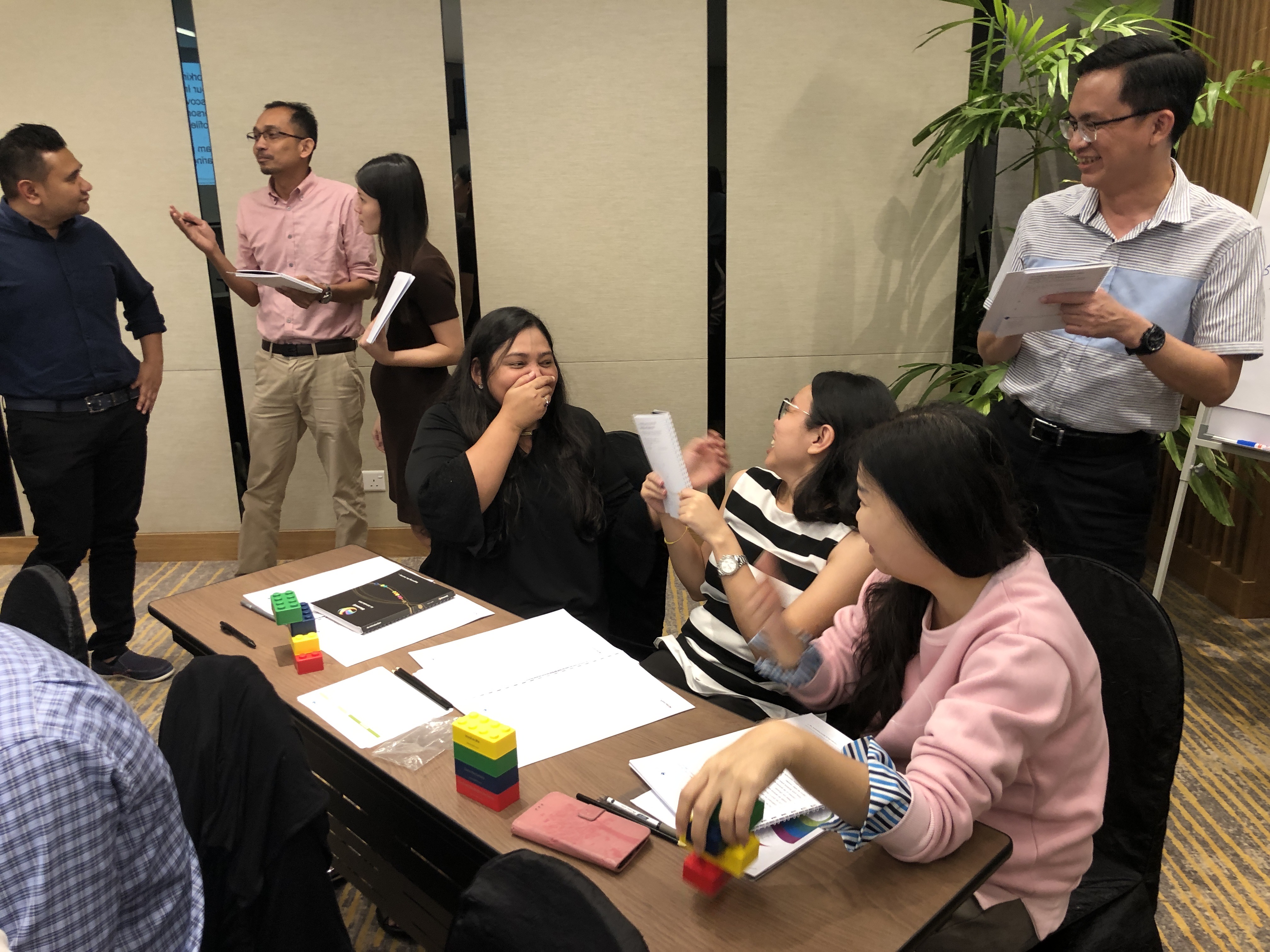 Workshop participants discussing their Insights Discovery profiles and colour preferences